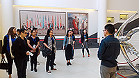 SJTU student ambassador leads a campus tour to the University’s museum and library for delegates